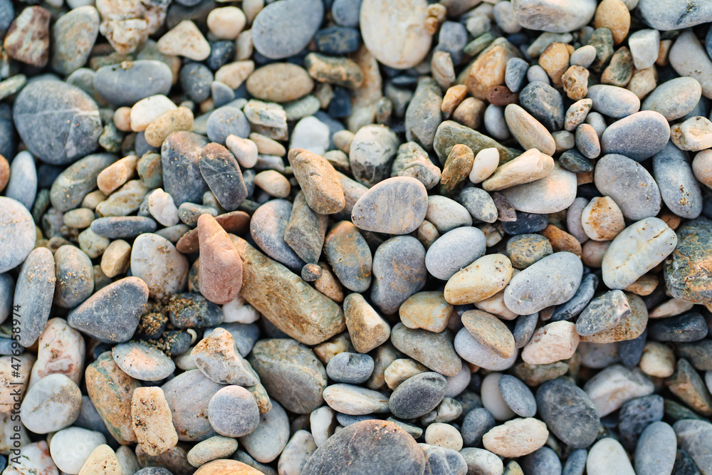 gray pebbles. pebble beach. stones for landscape design. background. gray pebbles. pebble beach. stones for landscape design. background.