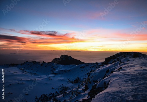 Top of Africa. Beautiful sunrise on Uhuru Peak Kilimanjaro in Tanzania. Adventure travel with trekking in Tanzania.