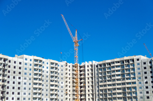 New flats and hoisting crane photo