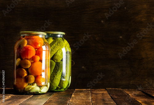 pickles in glass on a wooden table in a rustic style