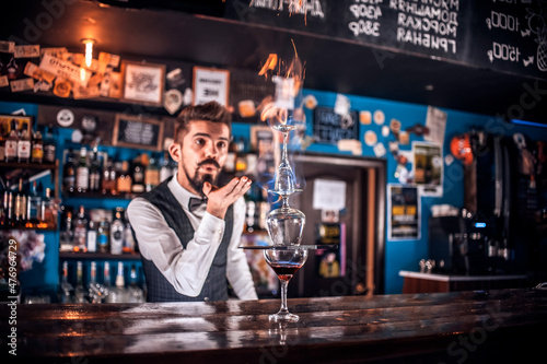 Barman mixes a cocktail on the beerhouse