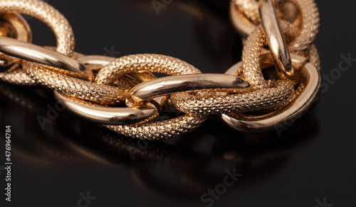 Gold chain on a black background.