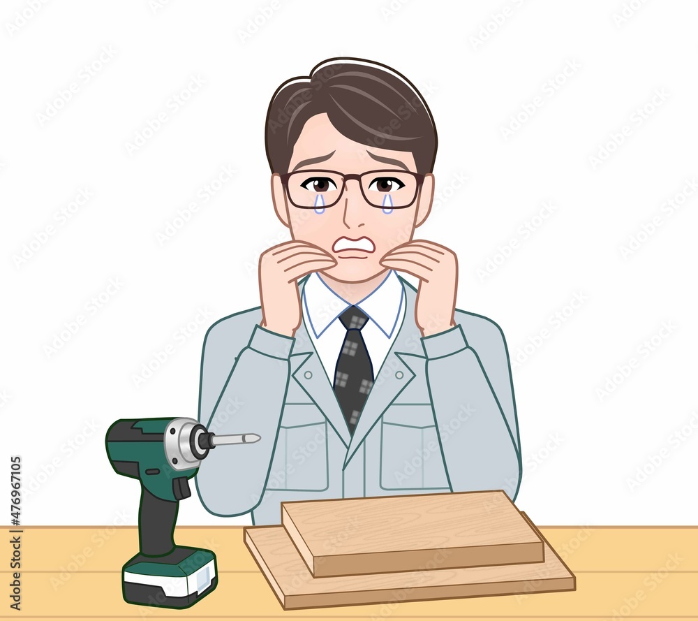 作業着を着た若い男性 作業着を着た若い男性
