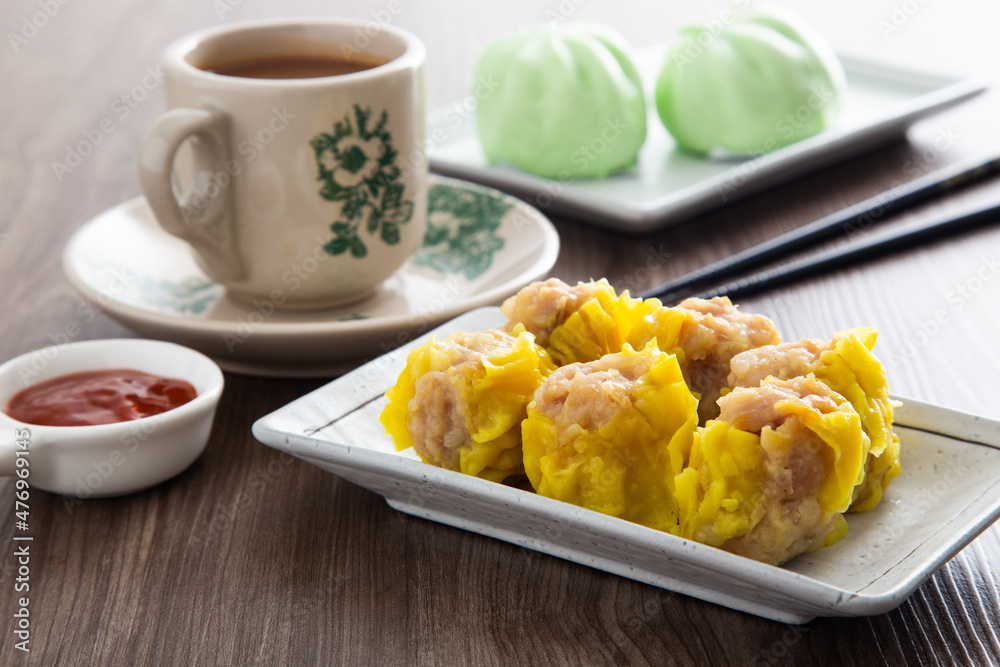 Siu Mai - Chinese steamed pork dumplings in bamboo steamers. Dim Sum