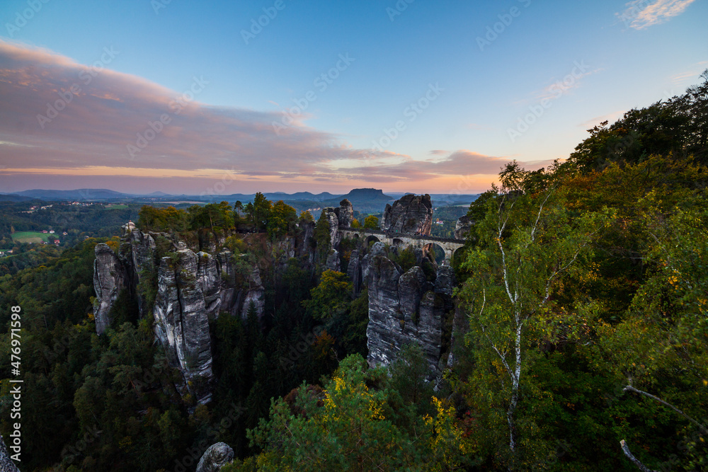 Fototapeta premium Bridge Bastei In Saxon Switzerland Germany utumn With Colored Trees sunset