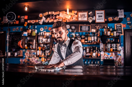 Barman formulates a cocktail at the saloon
