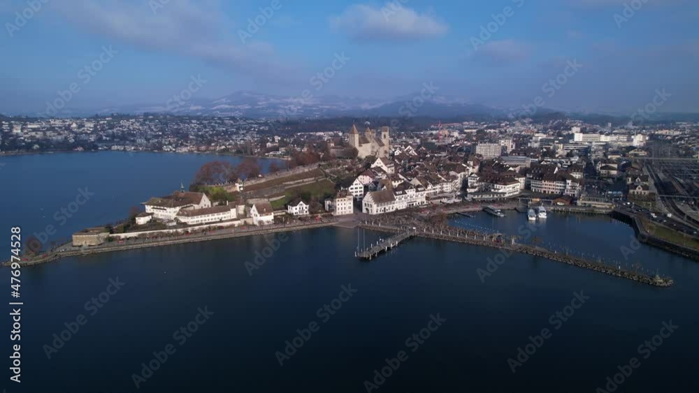 Beautiful skyline of old town Rapperswil and medieval castle, aerial orbit Beautiful skyline of old town Rapperswil and medieval castle, aerial orbit