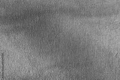 Grey canvas background. The surface of the texture of the grey fabric.