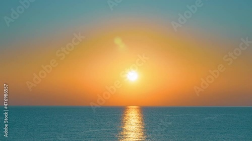 Colorful sunrise over sea and islands on a summer morning. 4K time-lapse