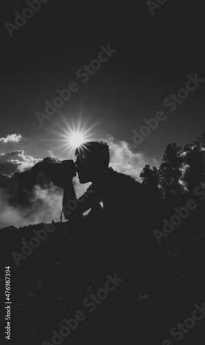 silhouette of a person in the mountains