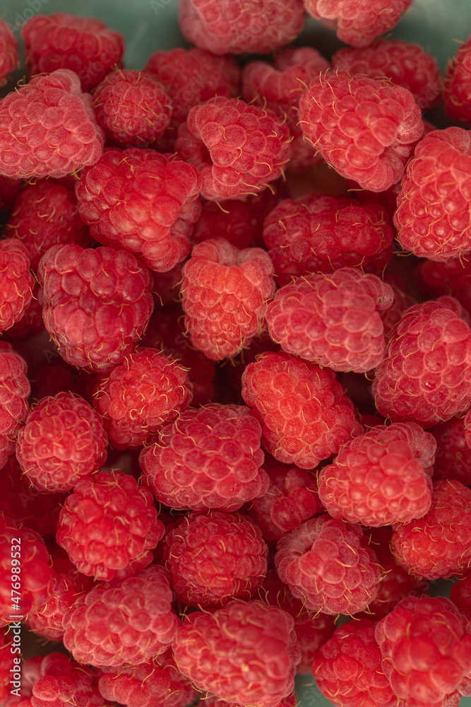 Ripe red raspberries on a plate. Ripe red raspberries on a plate.