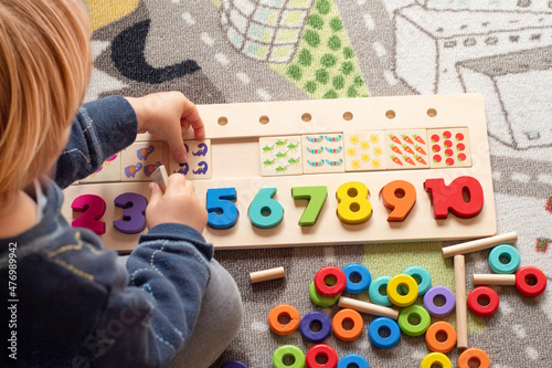 Baby toddler early development. Wooden stack and count rainbow colors learning game. Child learn colors and numbers