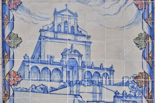 azulejos panel representing monuments and country scenes on the walls of Leiria station, Portugal..