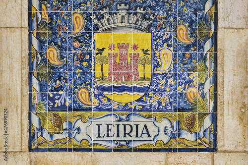 azulejos panel representing monuments and country scenes on the walls of Leiria station, Portugal..