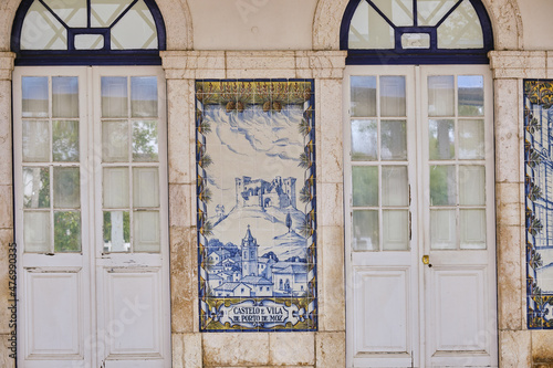 azulejos panel representing monuments and country scenes on the walls of Leiria station, Portugal..