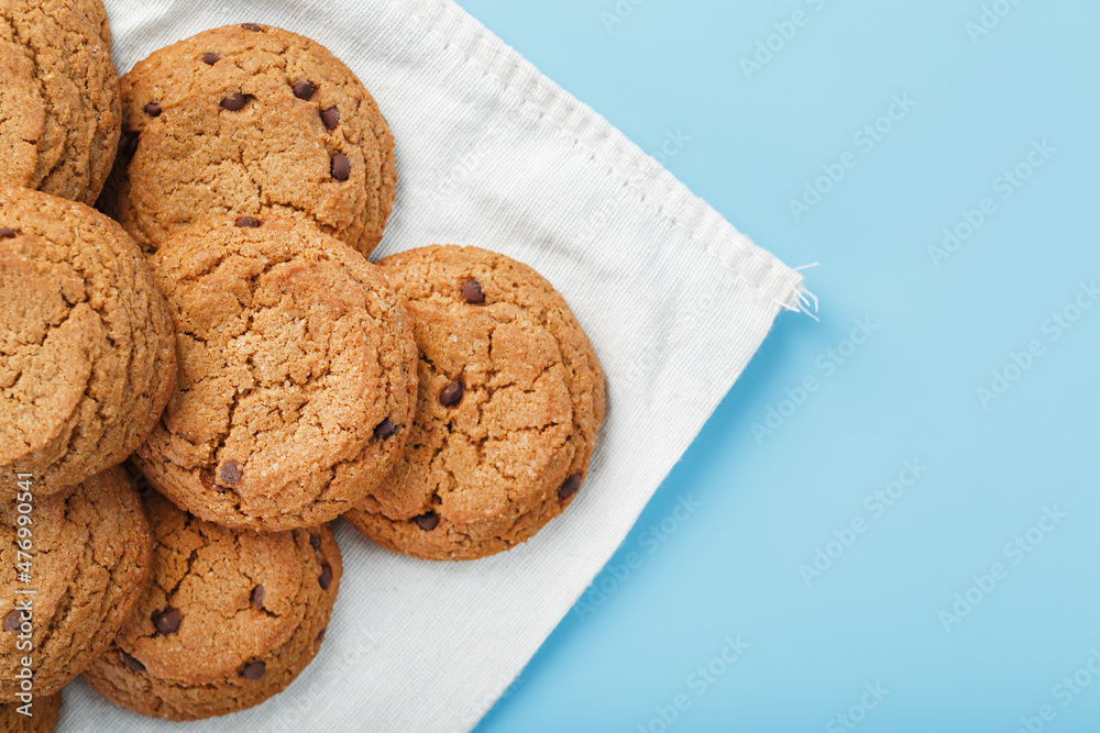 Oatmeal cookies on a napkin on a blue background Oatmeal cookies on a napkin on a blue background