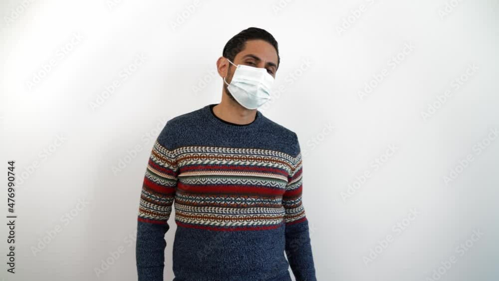 Portrait of caucasian man dancing with a medical mask during corona virus outbreak. Person dance at indoor studio shot isolated on white background Portrait of caucasian man dancing with a medical mask during corona virus outbreak. Person dance at indoor studio shot isolated on white background