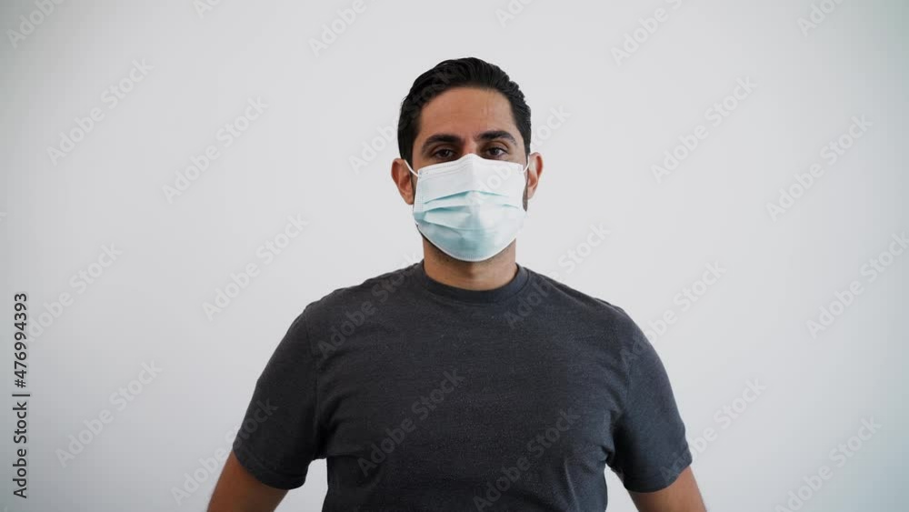 Portrait of caucasian man with a medical mask during corona virus outbreak. Person at indoor studio shot isolated on white background Portrait of caucasian man with a medical mask during corona virus outbreak. Person at indoor studio shot isolated on white background