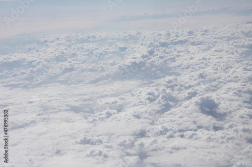 White clouds in the sky. View from the airplane window. Texture clouds background