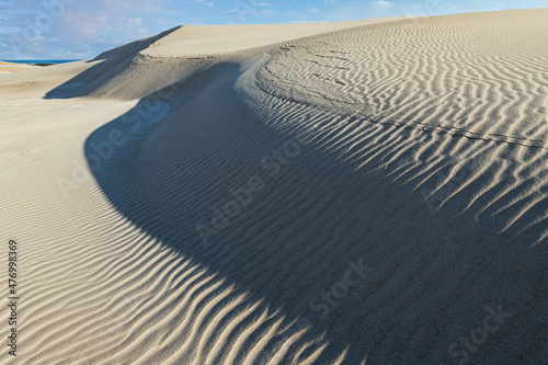 Fototapeta Naklejka Na Ścianę i Meble -  Winter landscape at sunrise, Silver Lake Sand Dunes, Silver Lake State Park, Michigan, USA