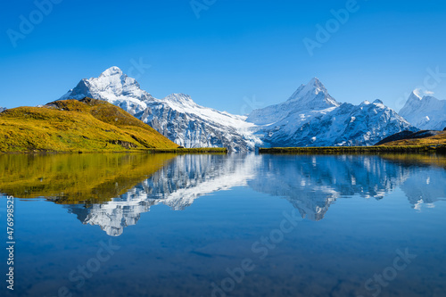 Bachalpsee, Grindelwald, Switzerland. High mountains and reflection on the surface of the lake.
