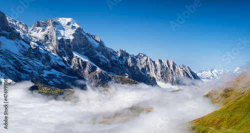Grindelwald, Switzerland. Mountains and clouds in the valley. Natural landscape high in the mountains.