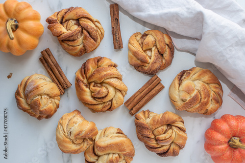 sweet home made pumpkin cinnamon roll on a table