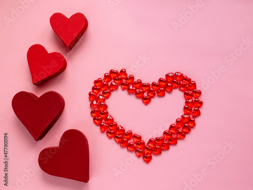 Valentine's day concept. Hearts on a red background. Gift paper boxes.