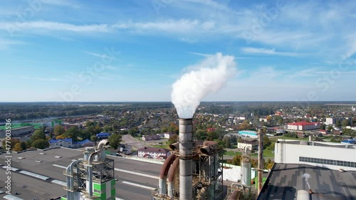 Smoke tower of industrial factory. Chimney smokestack emission.Refinery plant with pipes. Plant with smoke frow pipe and environmental pollution. Ecology concept and poor environment.
 photo