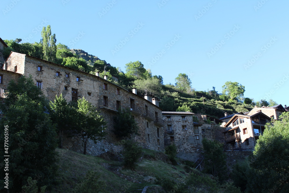 Old mountain village with stone houses and roofs