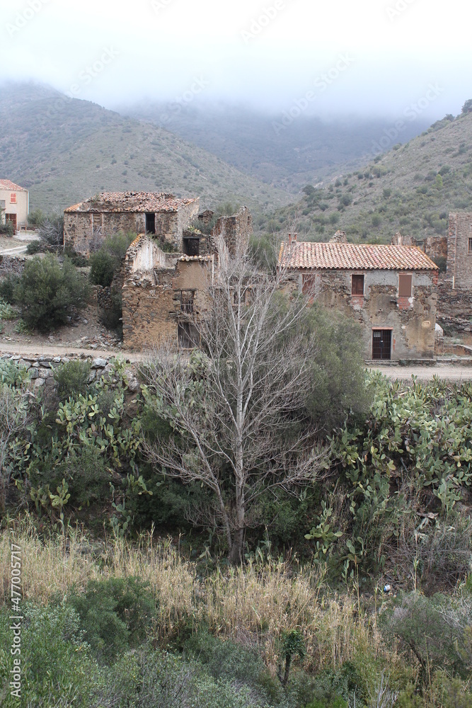Fototapeta premium Abandoned mountain village houses. Ghost village. Old stone houses in abandoned village 