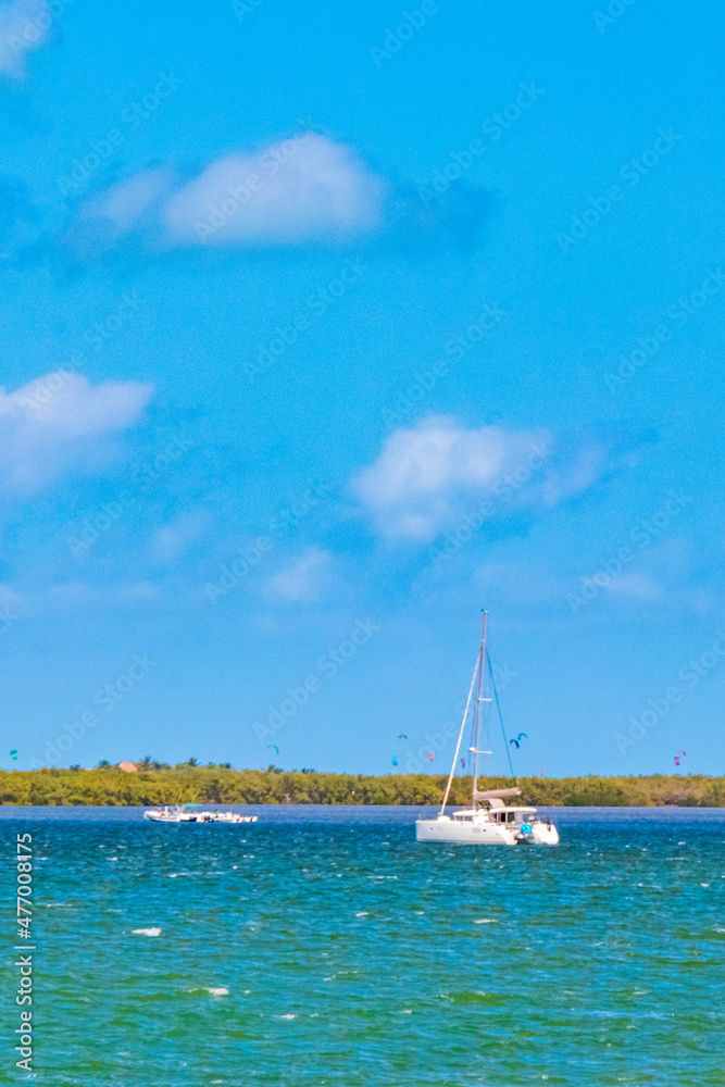 Panorama landscape view Holbox island turquoise water and boats Mexico.