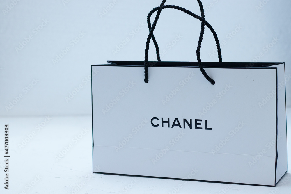 white paper bag from Chanel on 26. December 2021 in Berlin, Germany Photos  | Adobe Stock