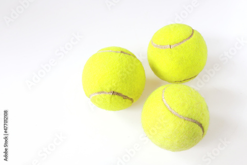 Tennis balls on white background, Isolated sport green balls. equipment closeup © emodpk