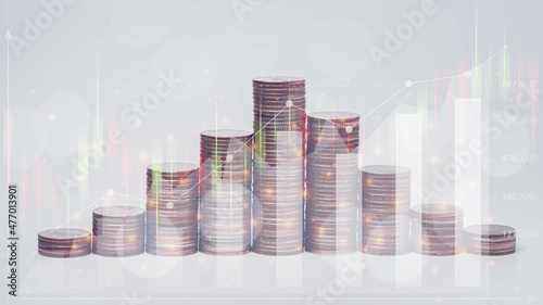 Double exposure of graph, stock display and money coins arranged as a graph, saving, business concept.