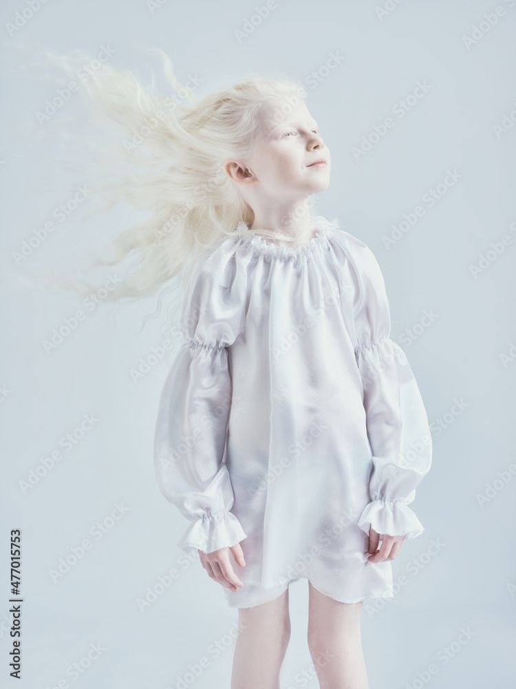 Little girl with white hair on a white background Little girl with white hair on a white background