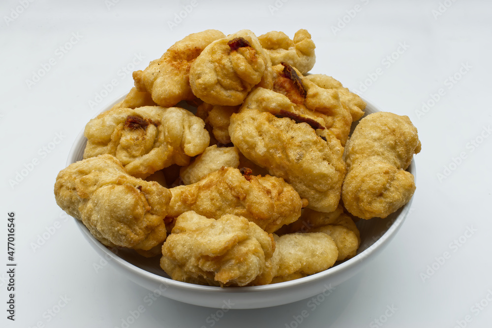 Traditional Italian Crispeddi Calabresi ca lici. Fried salted donuts with pieces of anchovies inside. Crispeddi are prepared especially in south Italy during the Christmas time. Traditional Italian Crispeddi Calabresi ca lici. Fried salted donuts with pieces of anchovies inside. Crispeddi are prepared especially in south Italy during the Christmas time.