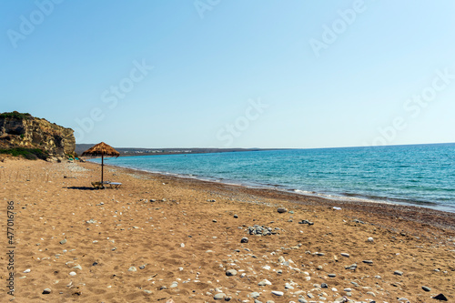 Umbrella and sun chairs at Paleopoli beach in Kythira, Greece