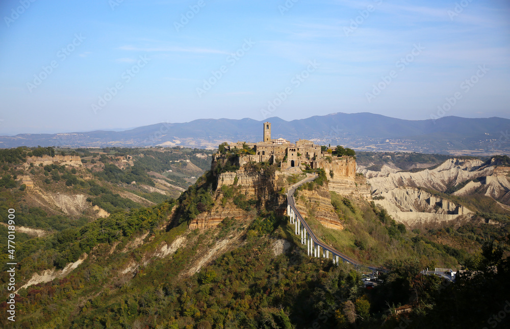 Panorama of Civita di Bagnoregio in the  Calanchi valley and with the mountain range background, Civita di Bagnoregio, Tuscia, Lazio, Italy