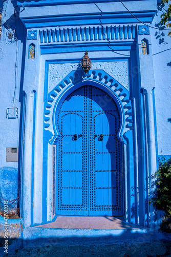 Closed arched entrance and building of old traditional town at Chefchaouen, the blue city in the Morocco © Aerial Film Studio