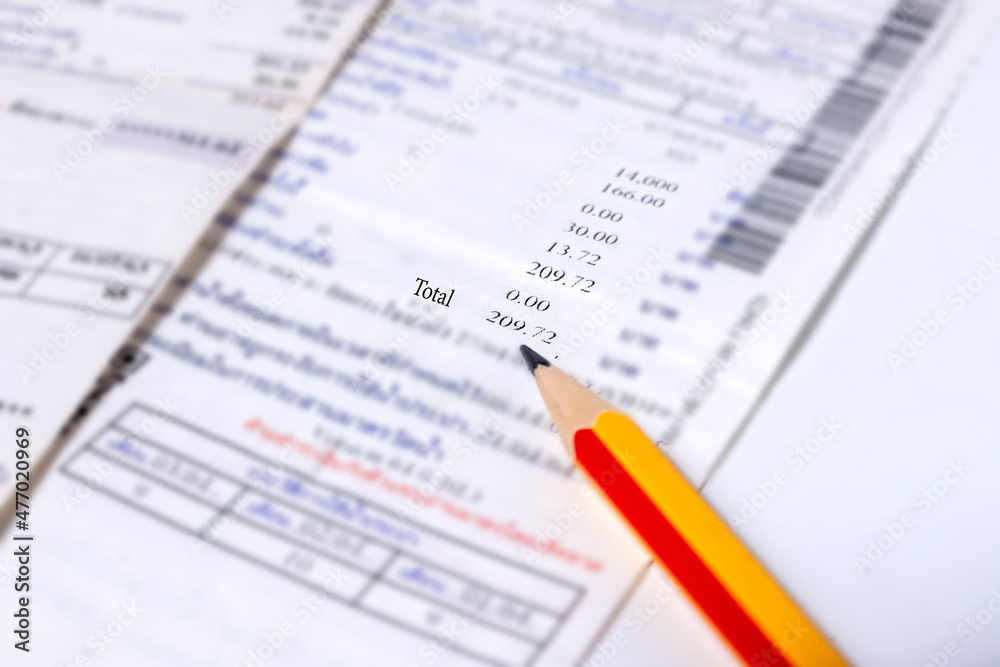 Utility energy bill with pencil blurred background Utility energy bill with pencil blurred background