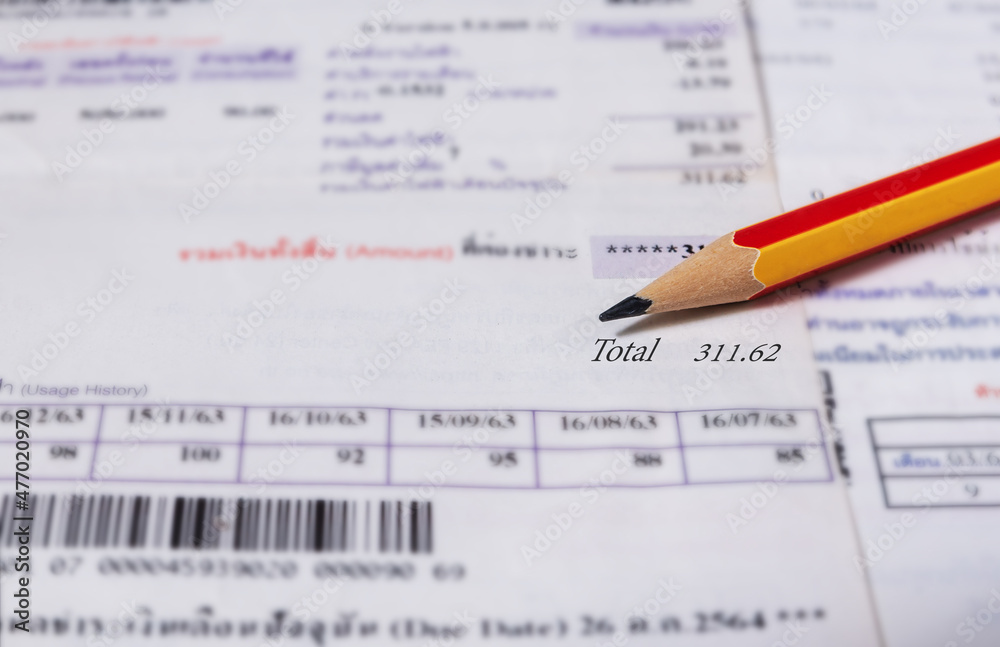 Utility energy bill with pencil blurred background Utility energy bill with pencil blurred background
