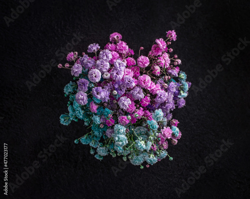 Top view of a flower on black background. Flat lay, top view. photo