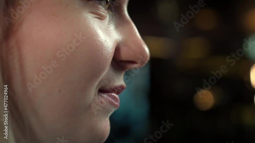 Caucasian Woman eating restaurant dish. Put fork in mouth.