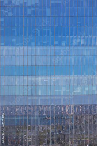 Glass facades of skyscraper...