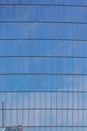 Glass facades of skyscraper...