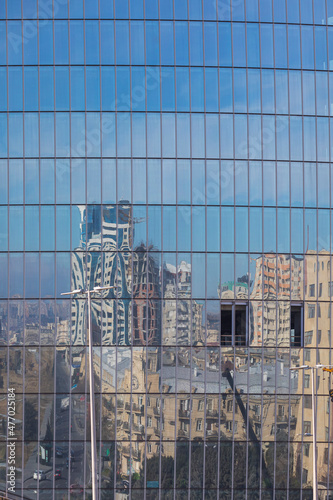 Glass facades of skyscraper...