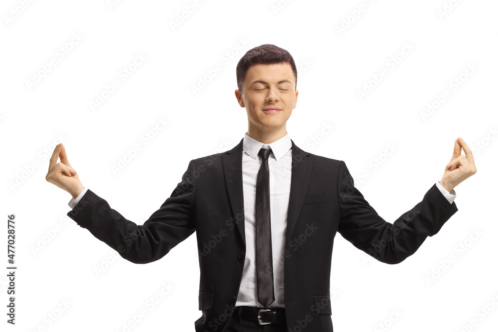 Guy in a suit and tie meditating Guy in a suit and tie meditating