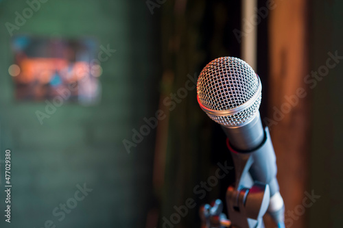 Close up of microphone in concert hall . Copy space . Selective focus photo