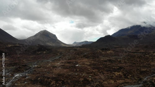 Aerial footage from the centre of the Isle of Skye near Portree and the Scottish Highlands, capturing the vast plains between the Cullin Mountain Range. photo